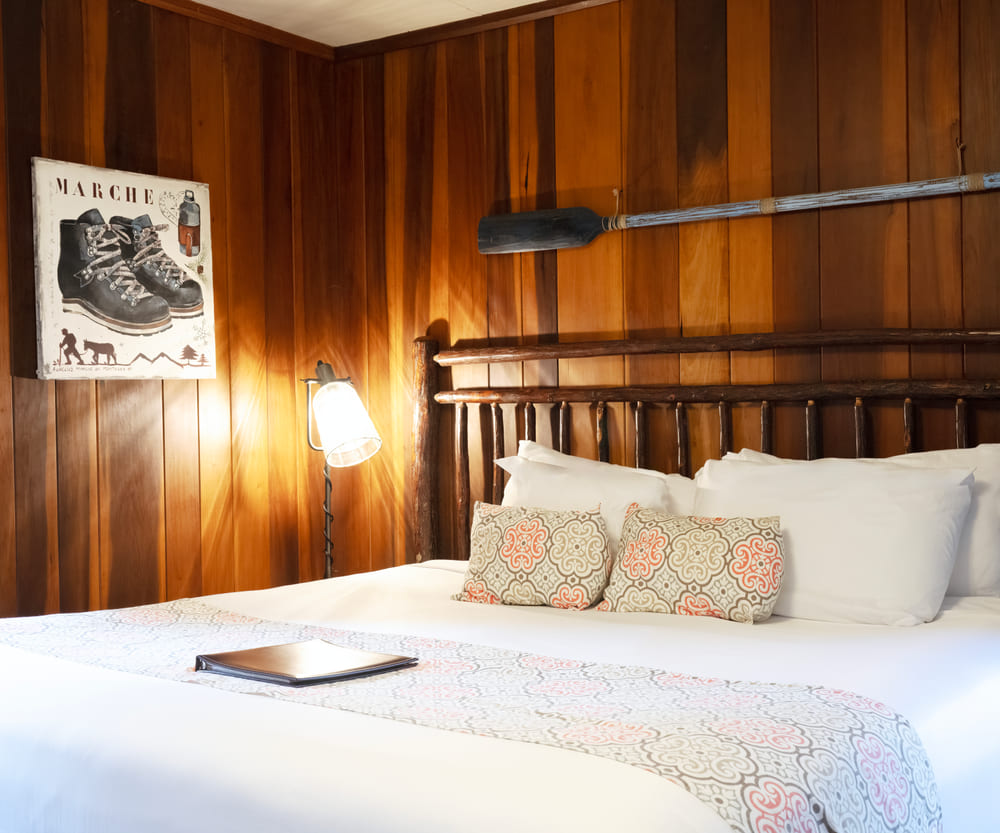 Wood-panelled guest room in the main lodge